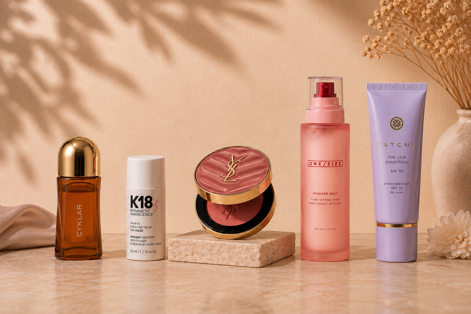 Authentic luxury beauty products styled on soft neutral linen